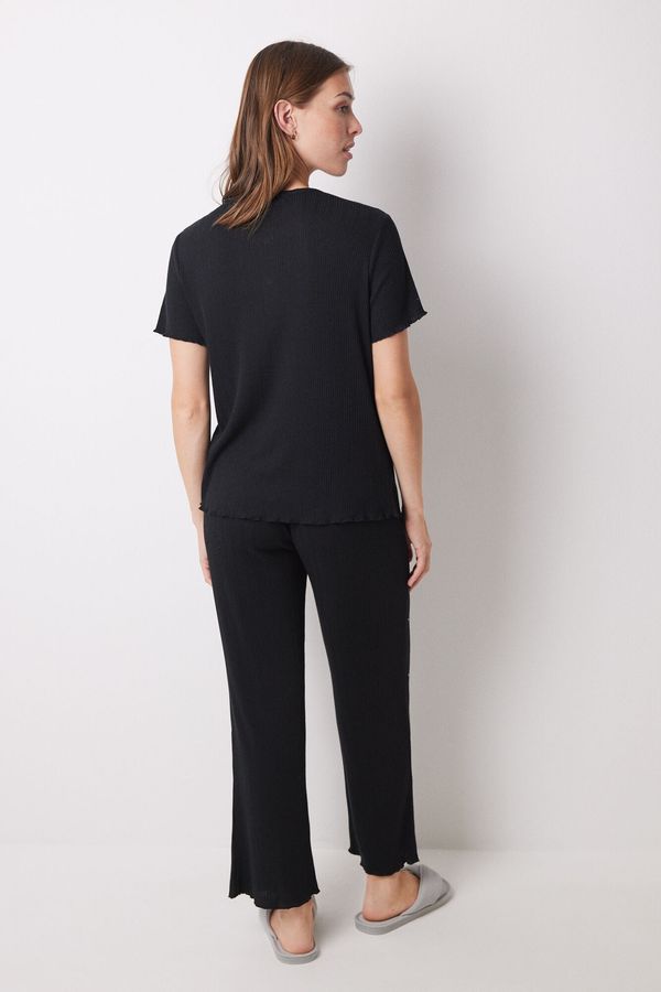 Conjunto canalé negro