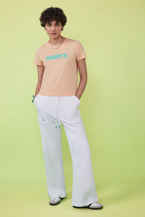 Pantalón largo flare felpa marfil
