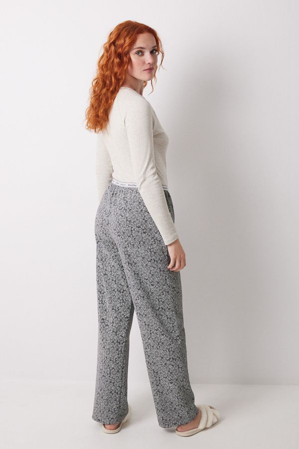 Pantalón estampado flores verdes