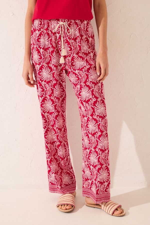 Pantalón largo viscosa estampado hojas rojo